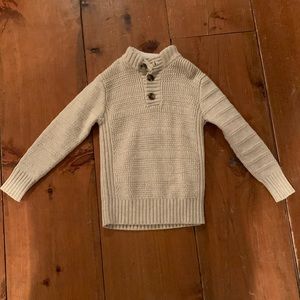 Cream colored kids sweater with buttons